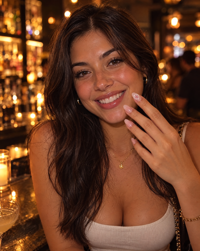 Woman showing the sticker at a bar